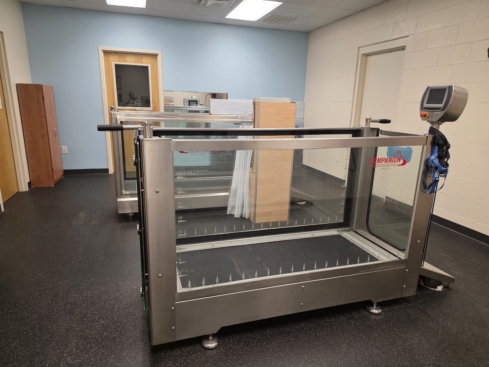 Two glass-walled underwater treadmills in the rehabilitation room at North GA Veterinary Specialists